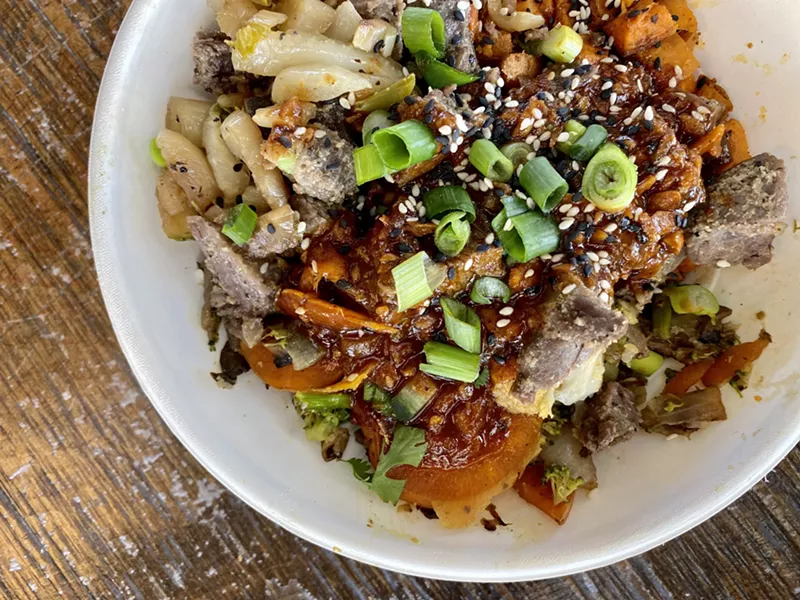 Image: The Spicy Korean Steak Bowl with half brown rice and half sweet potato hash as its base.