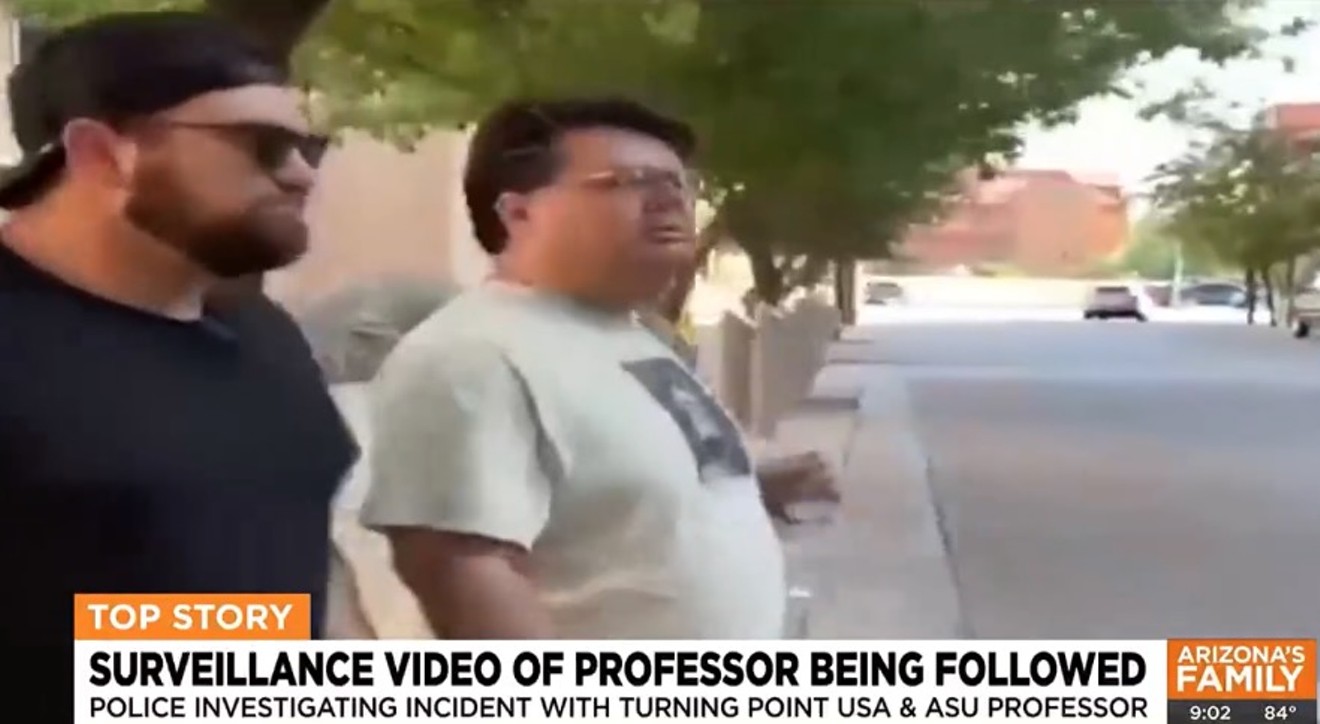 Turning Point’s Kalen D’Almeida approached ASU professor David Boyles (right) to berate him on Oct. 11.