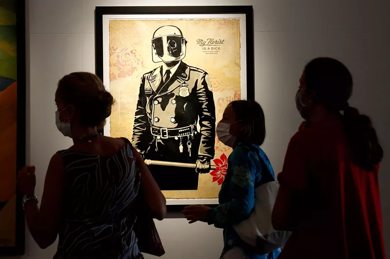 Image: A print of Shepard Fairey's "My Florist is a Dick" on display in Rome in 2020.