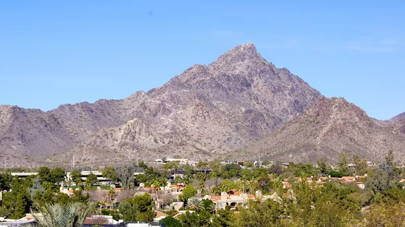 Image: houses below a desert mountain