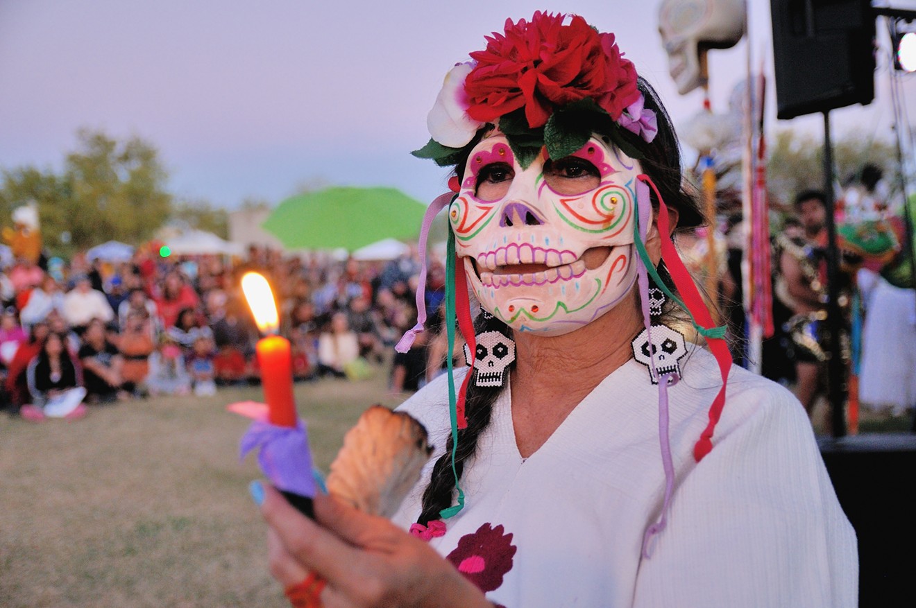 Attendees of a previous Mikiztli festival participate in the candlelight sunset procession.