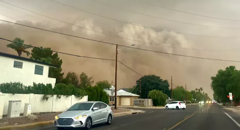 Image: a haboob blowing near a street