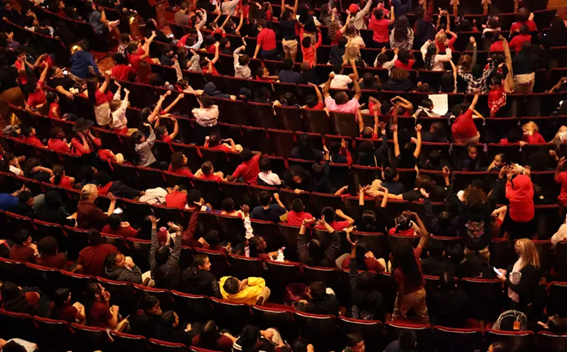 Image: Students wait for the Tetra String Quartet to perform at the Orpheum Theatre.