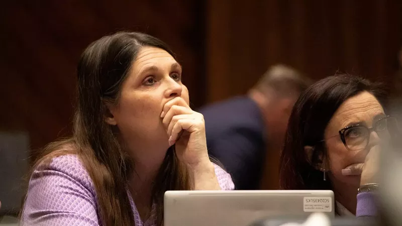 Image: Rep. Stephanie Stahl Hamilton, D-Tucson, watches with her hand on her chin as voting proceeds on her House Bill 2677, which repeals a near-total abortion ban that was recently upheld by the Arizona Supreme Court.