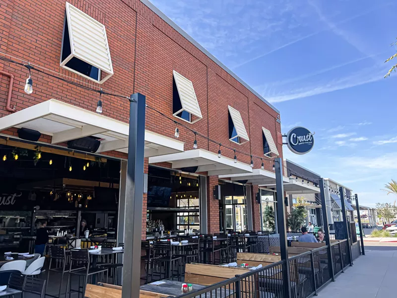 Image: The restaurant will include a wrap-around patio and garage doors that create an indoor-outdoor feel. Pictured here is Crust's Gilbert location.