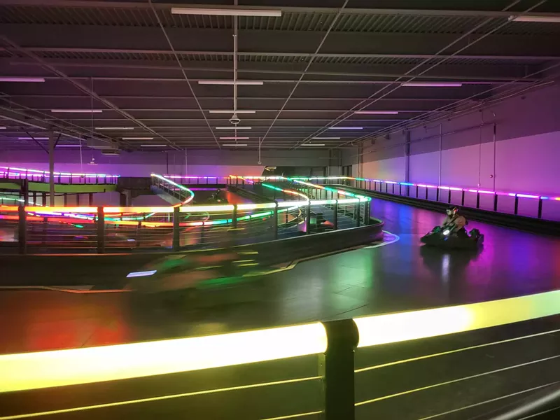 Image: An indoor lighted go-kart track.