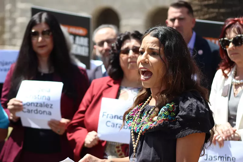 Image: analise ortiz speaks at an outdoor press conference