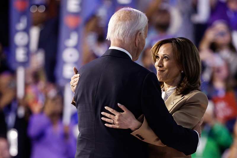 Vice President Kamala Harris greets U.S. President Joe Biden at the end of the first day of the Democratic National Convention in Chicago.