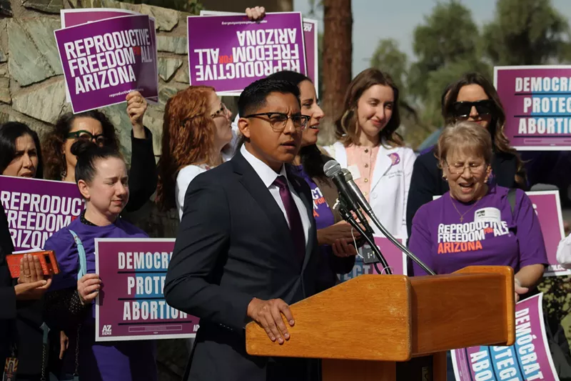 Image: oscar de los santos at a rally celebrating the repeal of Arizona's abortion ban