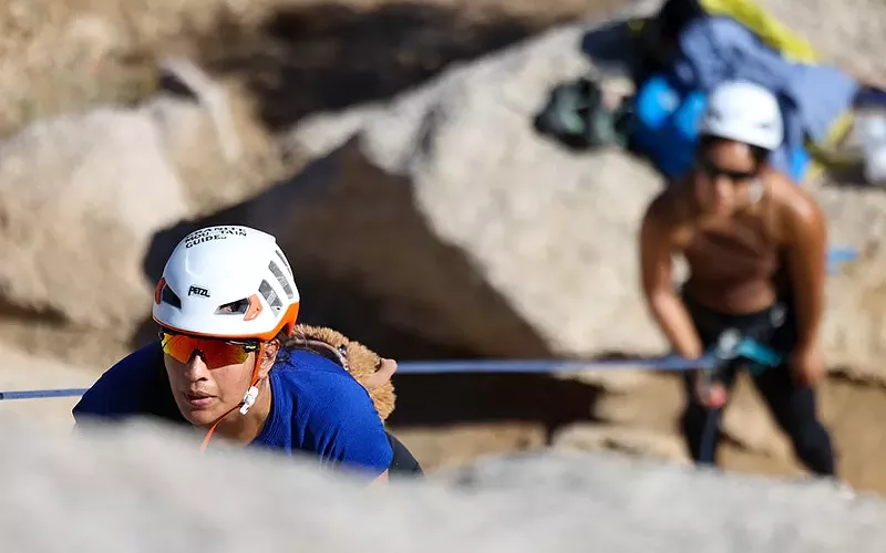 Image: Climber Ariana Cruz slab climbs as Leann Hernandez belays in the Girlie Man area at McDowell Mountain on Feb. 23, 2025, in Phoenix