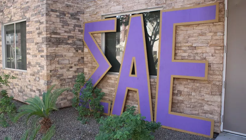 Image: big sigma alpha epsilon letters against a building