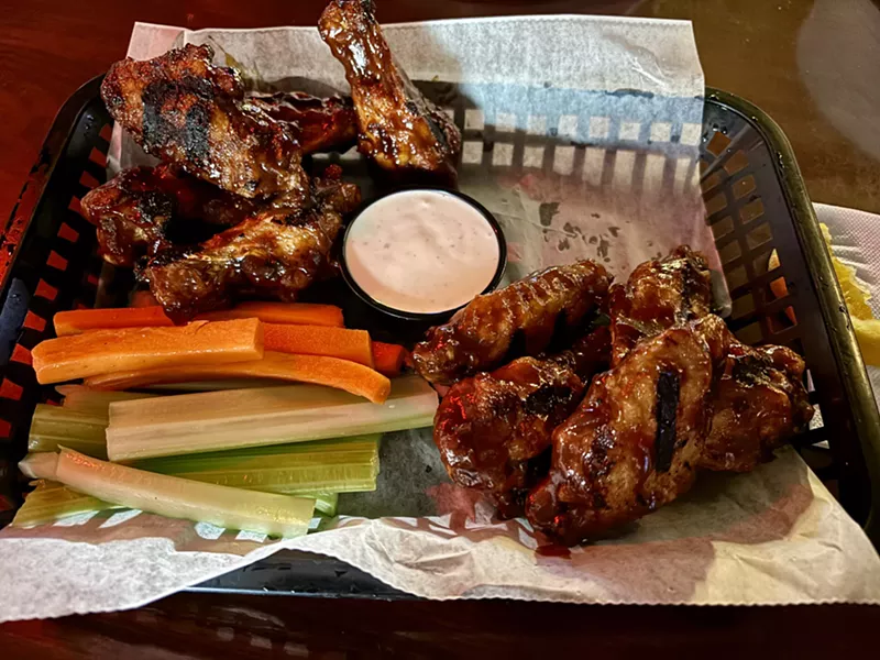 Image: Sit at the bar, chat with your neighbor and chow down on excellent grilled wings at JT's Bar & Grill.