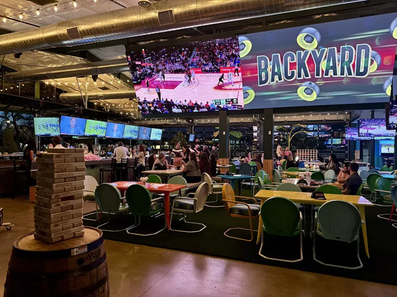 Image: Tables and TVs at Backyard.