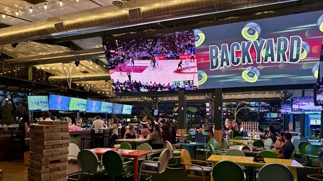 Tables and TVs at Backyard.