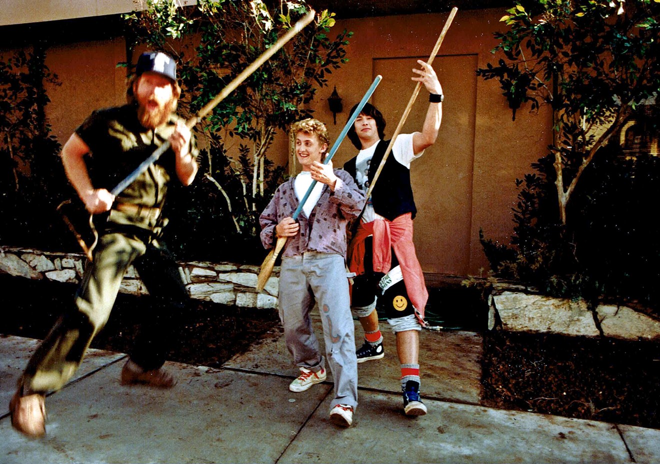 Alex Winter (center) and Keanu Reeves (right) clown around during the filming of "Bill & Ted's Excellent Adventure" in the Phoenix area.