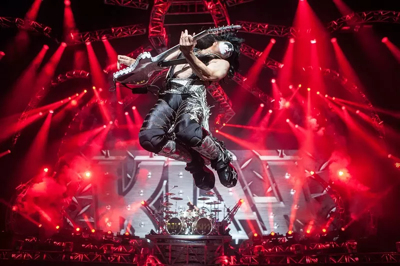 Image: Paul Stanley catches some air during a 2016 concert by KISS in Phoenix.