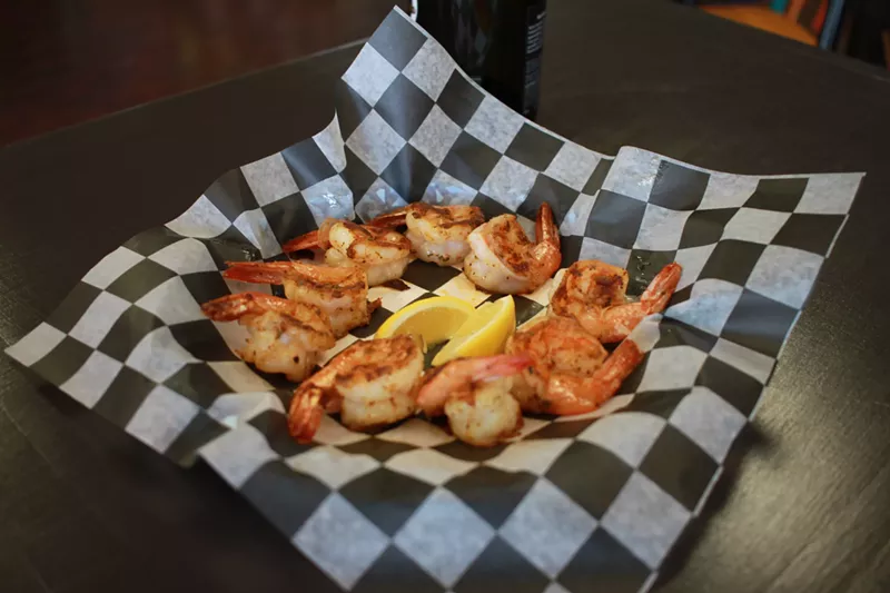 Image: There are a variety of ways to eat seafood at Chesapeake Bay. This shrimp is grilled and drizzled with garlic butter.