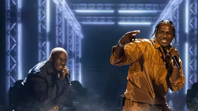 2 men perform on stage