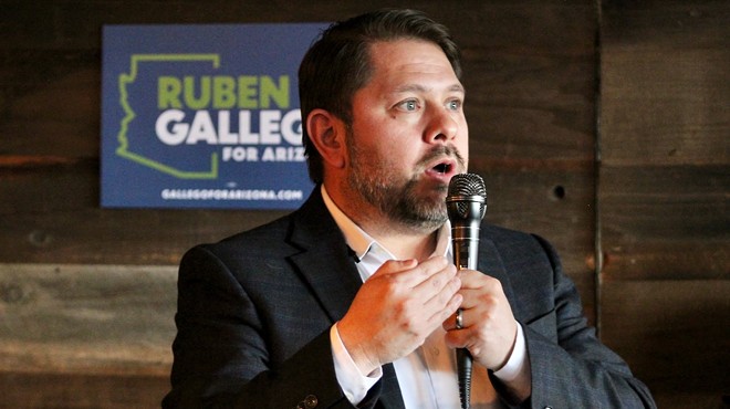 Ruben Gallego with a microphone