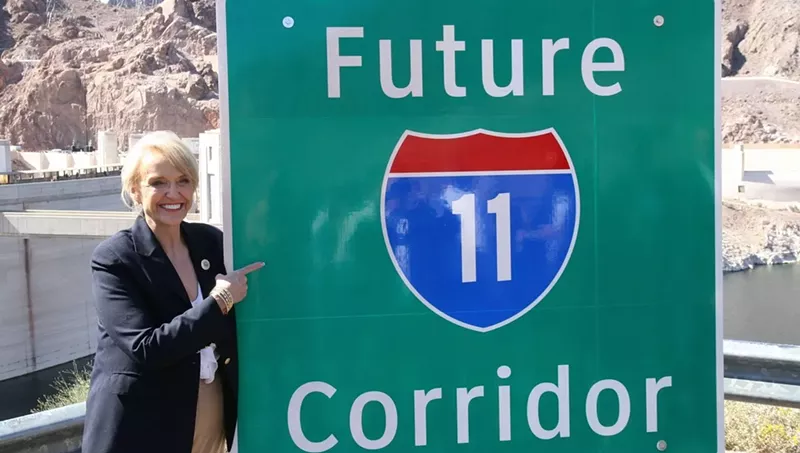 Image: Former Governor Jan Brewer unveils new signs at a March 2014 ceremony at Hoover Dam, after Congress designated the future Interstate 11 route.