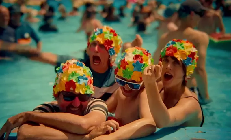 Image: People in bathing caps.