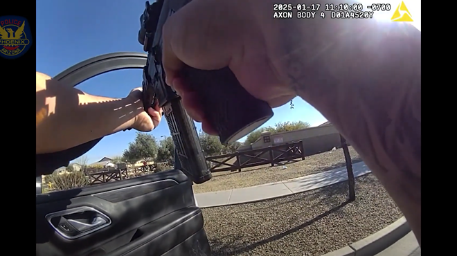 body-cam footage of hands holding a rifle out an open car door