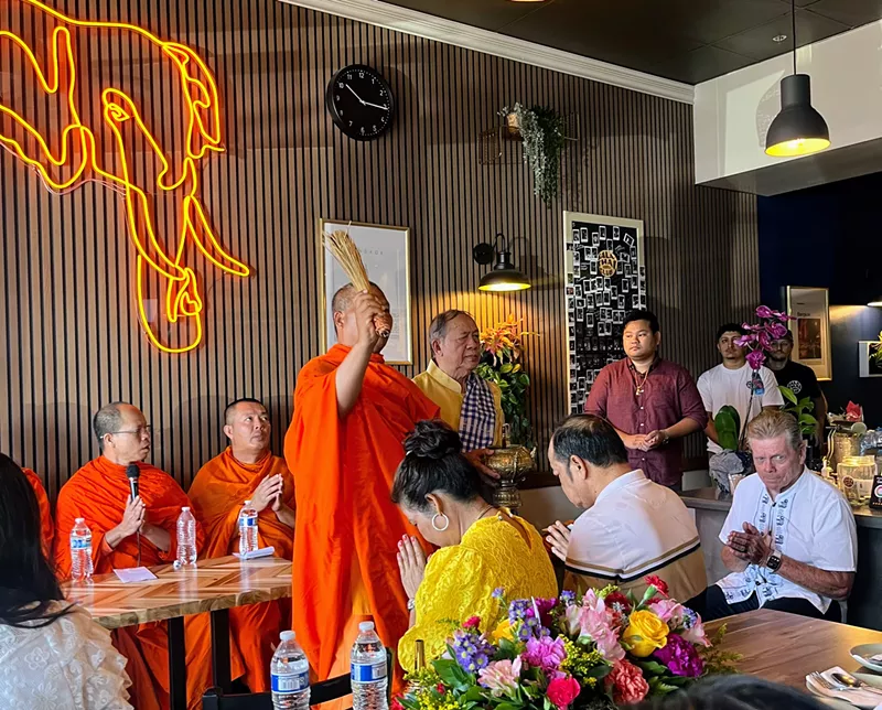 Image: During a ceremony to mark the first anniversary of Sala Thai in Tempe, a group of Thai monks blessed the restaurant.