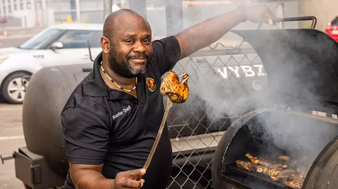 Cool Vybz chef grills chicken.