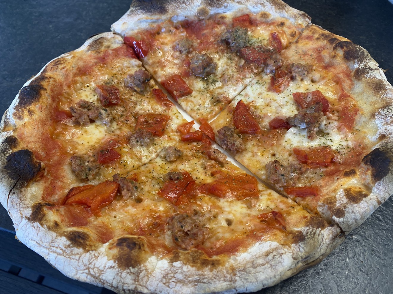 Salsiccia pizza is impossibly crispy and topped with Arcadia Meat Market's spicy Italian sausage at Source.