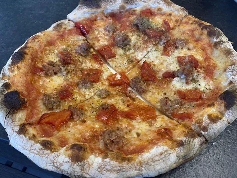 Image: Salsiccia pizza is impossibly crispy and topped with Arcadia Meat Market's spicy Italian sausage at Source.
