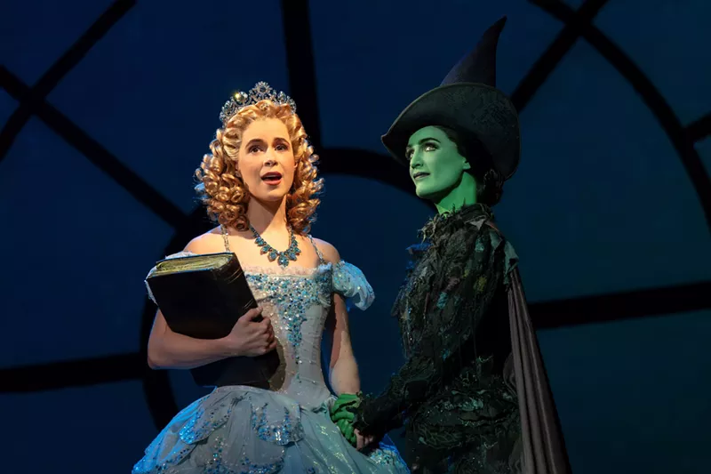 Image: Two women dressed as a princess and a witch.