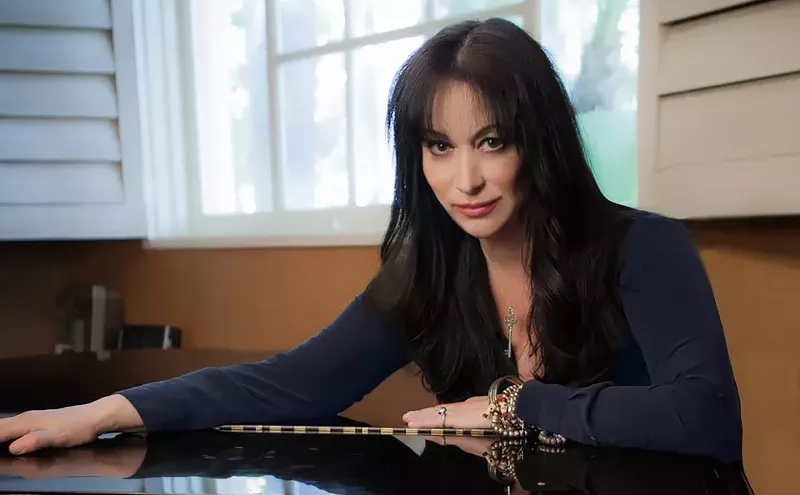 Image: Songwriter Holly Knight signs her memoir in Tempe