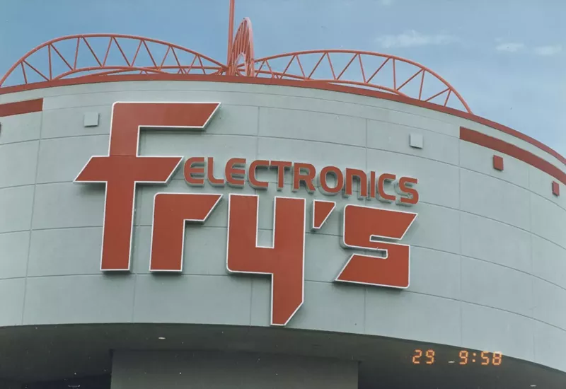 Image: The main sign of a gray big-box tech store.