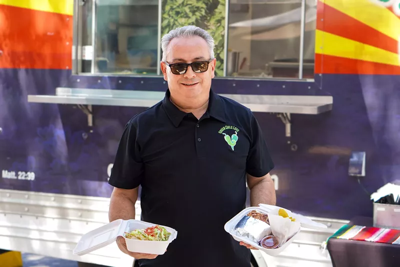 Image: Green Chile Love owner and chef Dave Castaneda shows off two of the food truck's most popular dishes: a smothered burrito and the Mexican Hamburger.