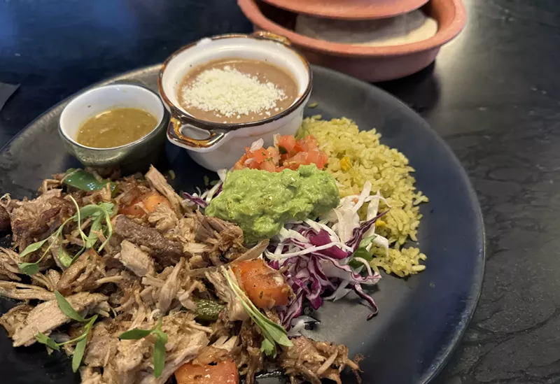 Image: The Guadalupe on Main's carnitas plate comes with a pile of roasted pork, rice, beans and plenty of accouterments to stuff into corn tortillas.