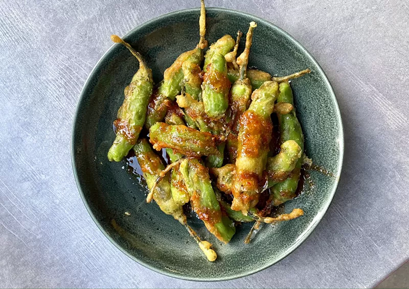 Image: Happy Hour Tempura Fried Shishito Peppers keep your fingers busy and saucy.