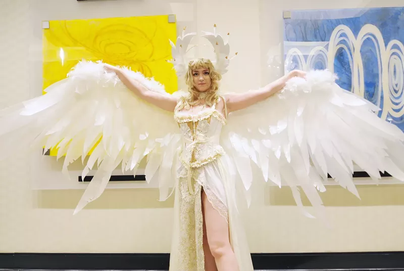 Image: A woman dressed in a winged costume.