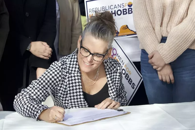 Image: Gov. Katie Hobbs signed a signature petition form for the Arizona Abortion Access Act on Tuesday. The Democrat has been a staunch proponent of abortion rights in her first year.