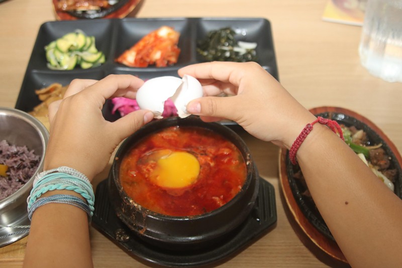 Each tofu soup comes with a raw egg; by tradition, the diner cracks the egg and poaches it inside the piping-hot soup.