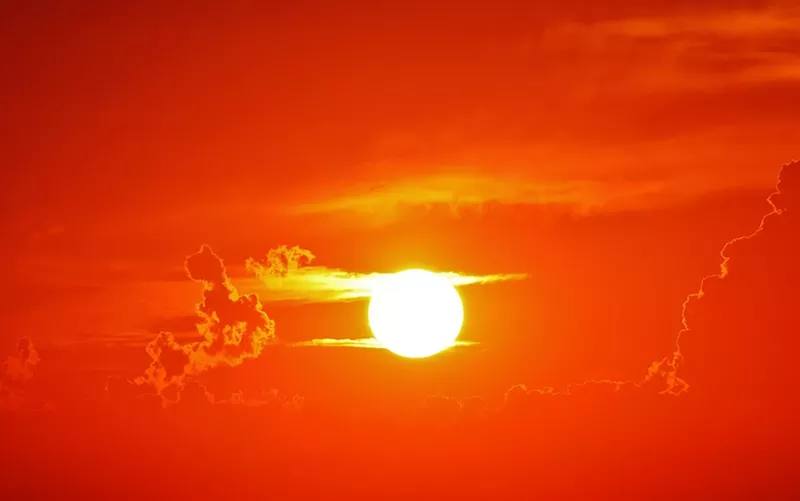 Image: a sun in an orange sky