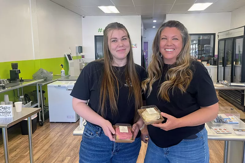 Image: Mother-daughter duo Erica White (right) and Hannah Miles serve standout cinnamon rolls at their company Rolled Out Bakery.
