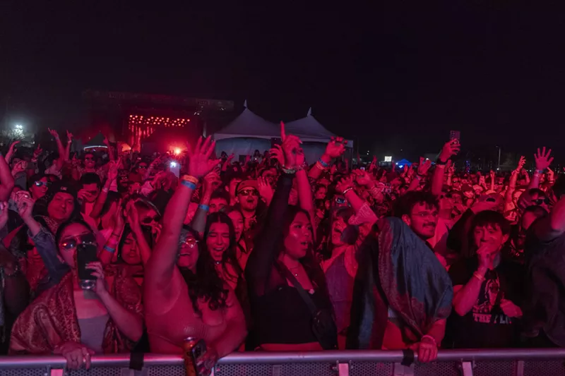 Image: Fans dance to the music while at the M3F music festival on March 1, 2024