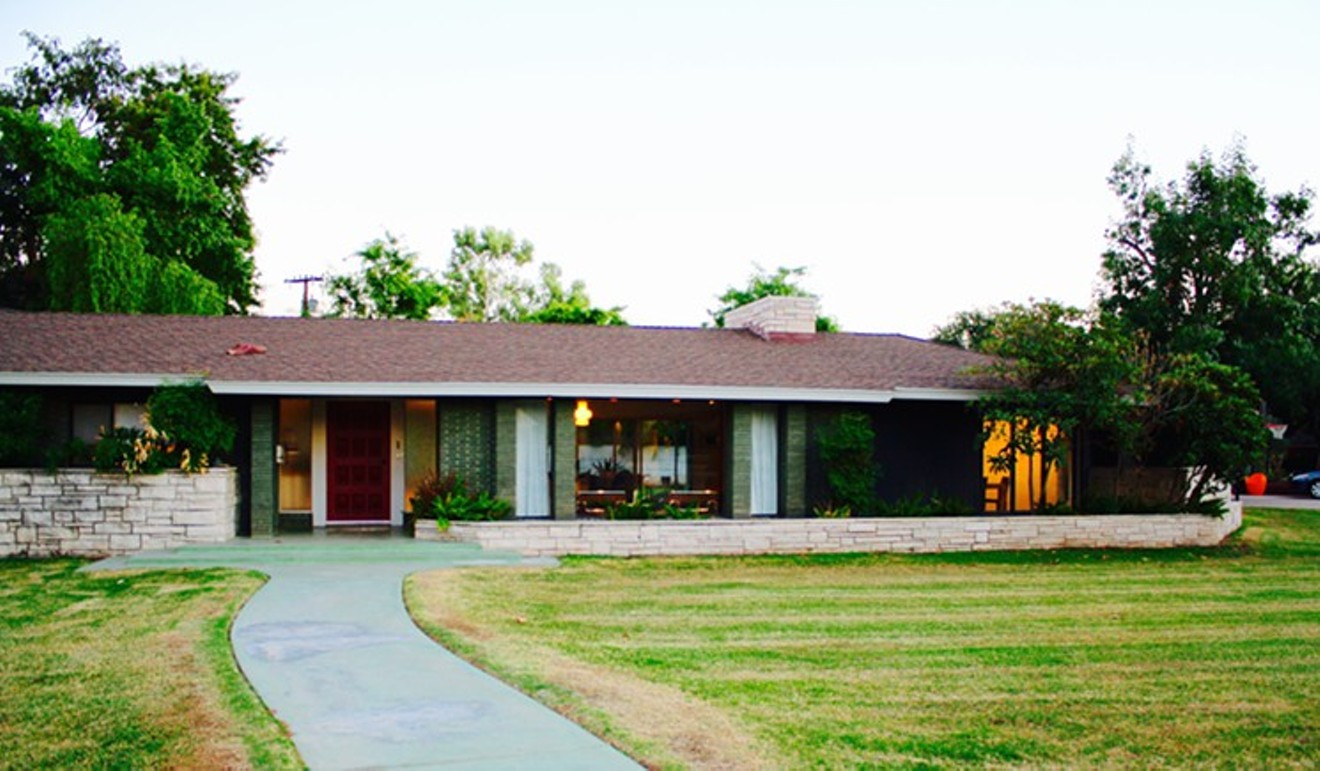 The inviting exterior of the Adkins' midcentury modern rambler.