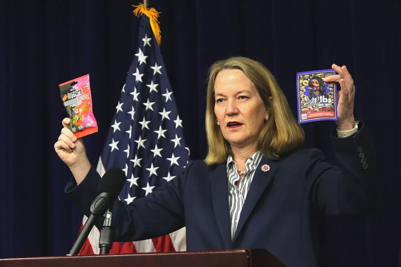 Image: arizona attorney general kris mayes holds up THC-infused products that she said are being illegally sold