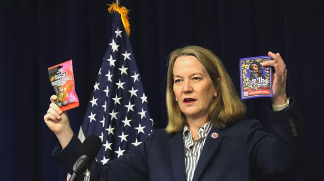 arizona attorney general kris mayes holds up THC-infused products that she said are being illegally sold