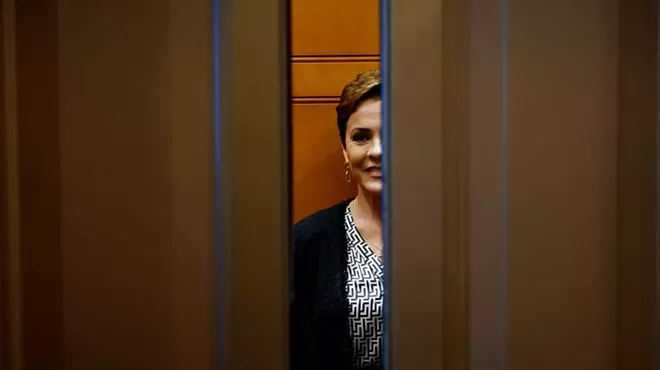 elevator doors close on a smiling kari lake