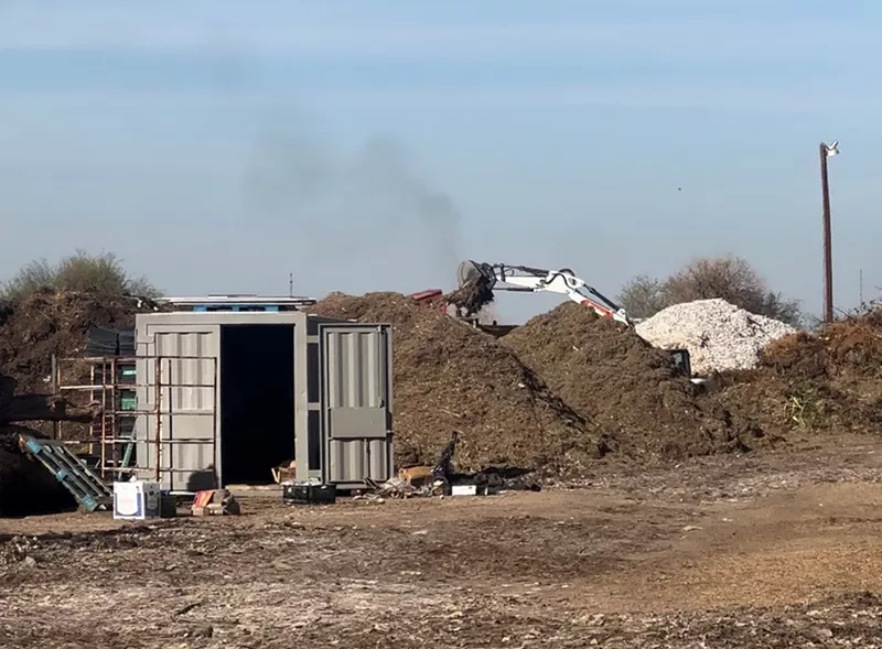 Image: excavators and mounds of dirt