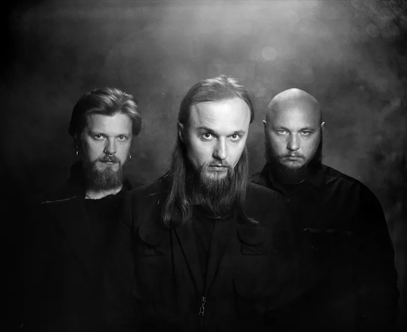 Image: A black and white photo of three men.