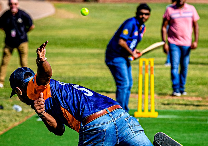 A member of the North Phoenix Cricket Club bowls to a batter during the opening ceremony for Phoenix’s first official cricket pitches on Sept. 27.