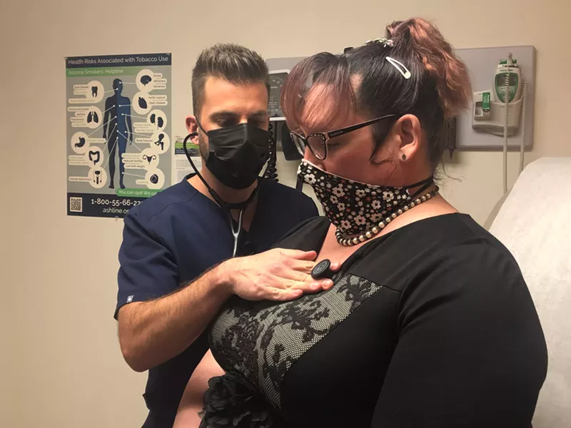 Image: Taylor Piontek, director of clinical services and a family nurse practitioner at Southwest Center, examines a patient.